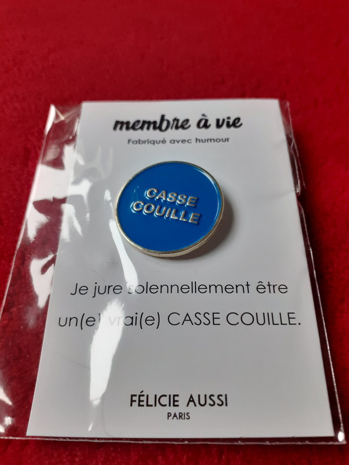 Félicie Aussi - Pin’s – CASSE COUILLE - bleu